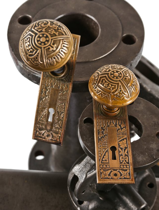 complete set of original 19th century american ornamental wrought brass "ceylon" pattern residential doorknobs and backplates