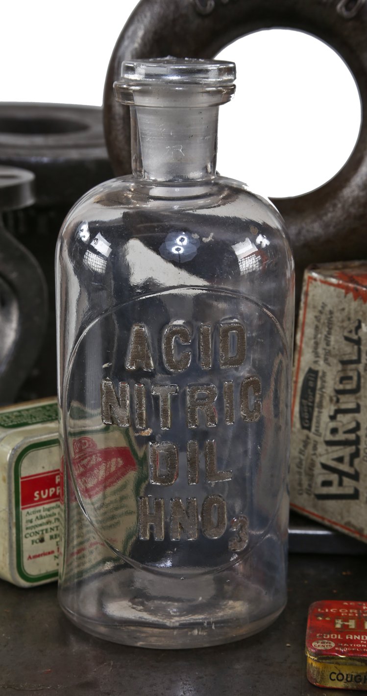 old american industrial chemistry reagent bottle with embossed letters salvaged from a university of chicago laboratory
