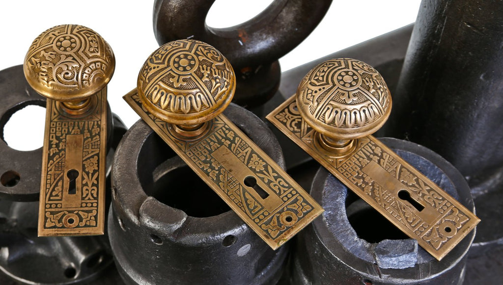 lot of late 19th century original and remarkably intact ornamental wrought brass "ceylon" pattern passage door escutcheons and doorknobs