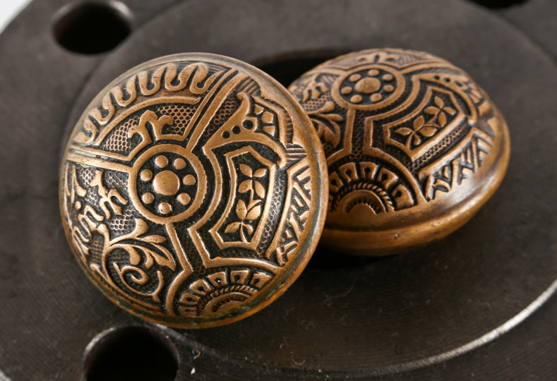 original matching dome-shaped "ceylon" pattern wrought ornamental brass passage size residential doorknobs with banded rims