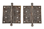 two matching original loose pin ornamental cast iron interior residential door hinges with traces of a copper-plated finish