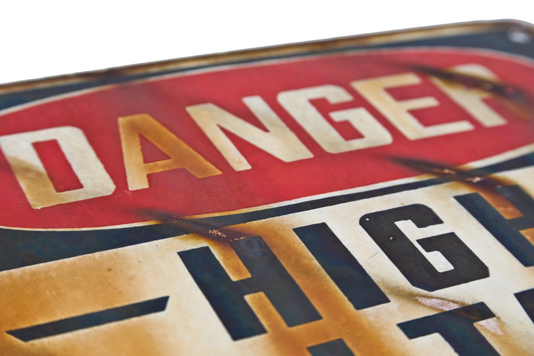 c. 1940's single-sided die cut steel "high voltage" exterior factory fence mounted danger or cautionary sign with great surface patina