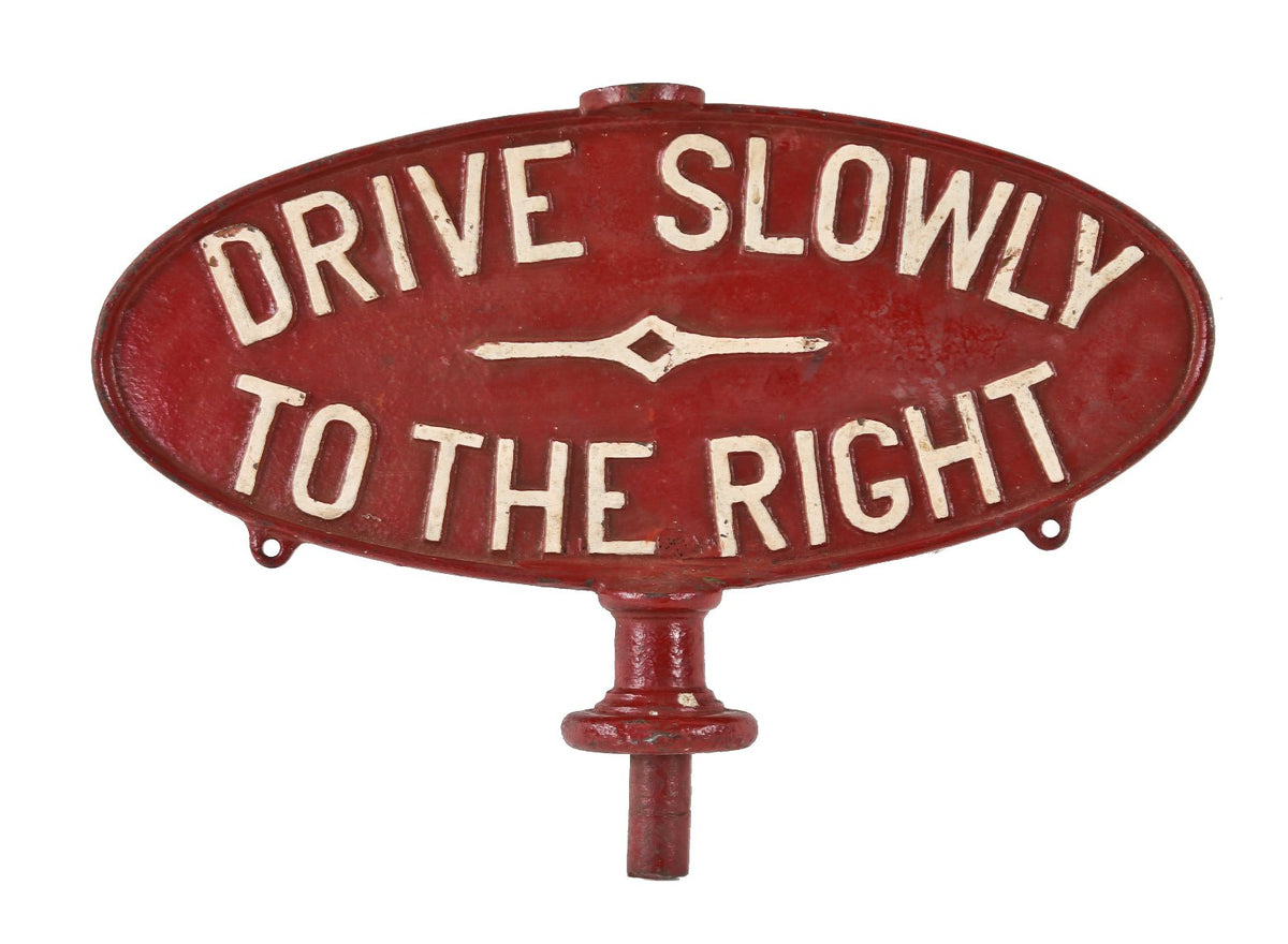 hard to find early 20th century double-sided chicago city street heavy cast iron oval-shaped "drive slowly" traffic sign with red and white enameled finish