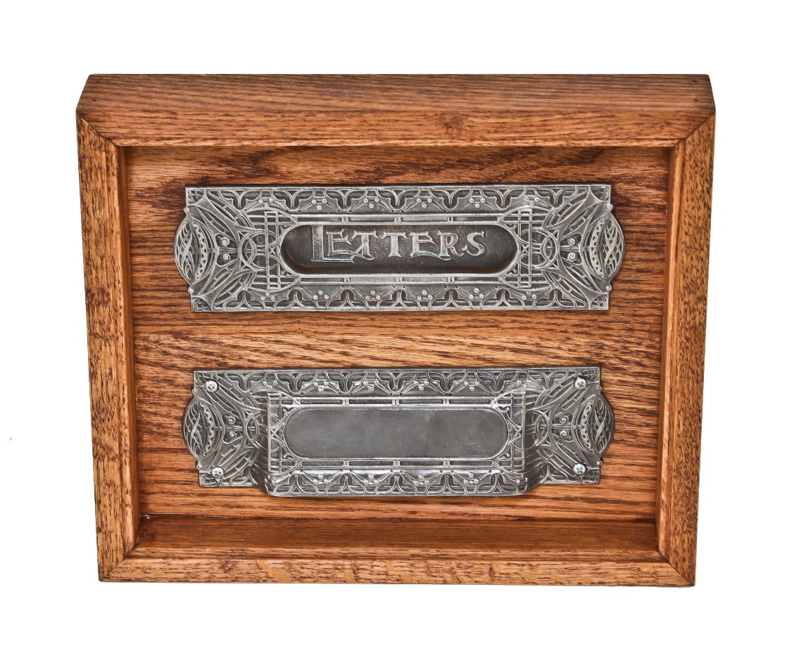 original and complete set of louis h. sullivan-designed ornamental cast iron chicago stock exchange interior office door mail slot with chute