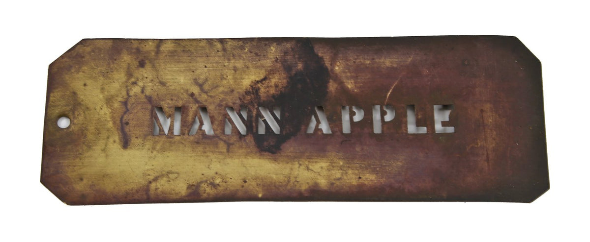 early 20th century single-sided wrought yellow brass "mann apple" stencil letter template with nicely aged surface patina