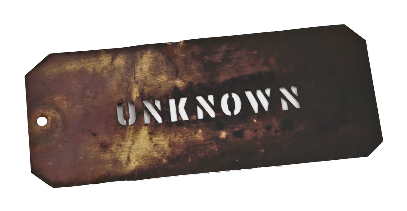 single-sided early 20th century antique american industrial wrought brass metal "unknown" letter stencil template plate