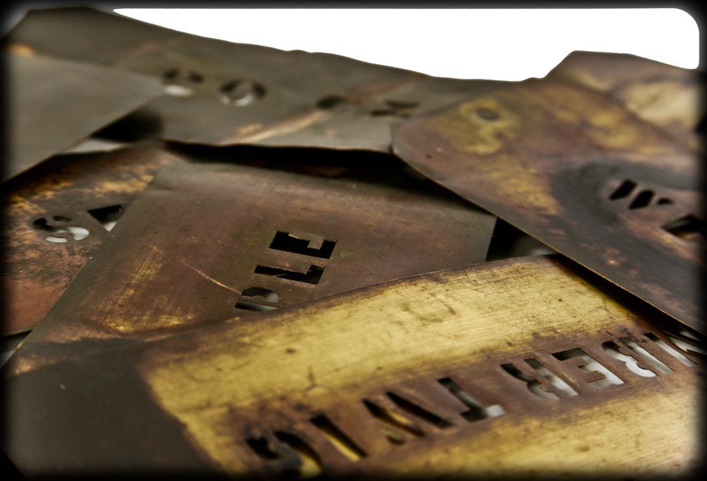 original american industrial single-sided "limber twig" apple brand wrought brass metal stencil template from a chicago sign shop