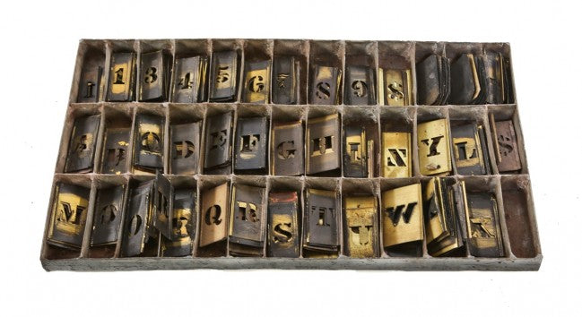 hard to find all original large lot of turn of the century american industrial interlocking wrought yellow brass sign making stencil letters with original case