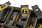 hard to find all original large lot of turn of the century american industrial interlocking wrought yellow brass sign making stencil letters with original case