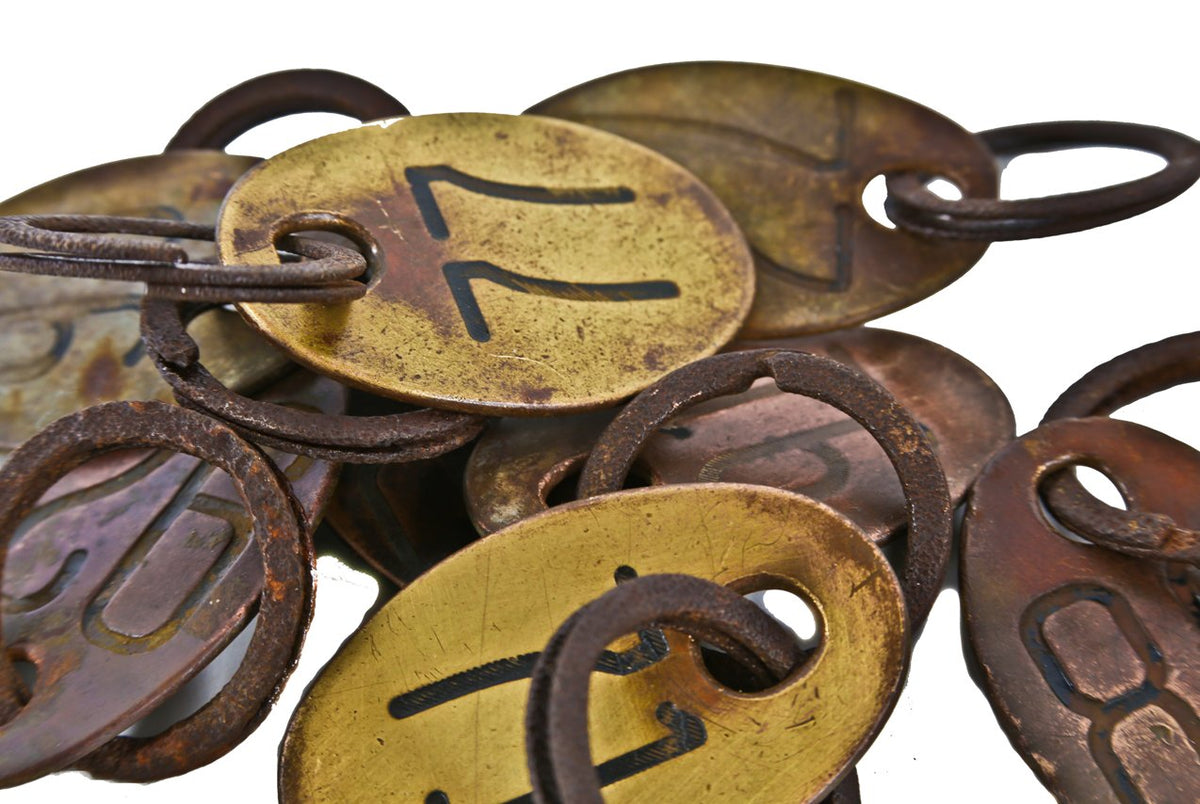 nicely aged original c. 1920's american industrial heavy wrought brass metal cow identification tag with double-sided numbers