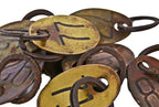 american industrial oval-shaped wrought yellow brass double-sided lightly incised cow identification tag with steel ring
