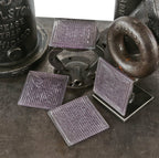 set of four original early 20th century "sun-purple" frank lloyd-wright designed "geometric flower" exterior building transom luxfer prism tiles