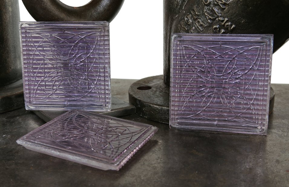 three matching all original early 20th century "sun-purple" luxfer exterior building transom prism tiles designed by frank lloyd wright