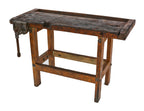 early 20th century american industrial weathered and worn oak wood stationary four-legged shop workbench with rapid acting vise