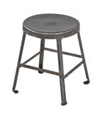 original c. 1930's american industrial cold-rolled steel riveted joint four-legged stool with inward turned ball feet