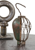 completely intact early 20th century american industrial "flexco" steel light bulb guard with integrated reflector and original finish