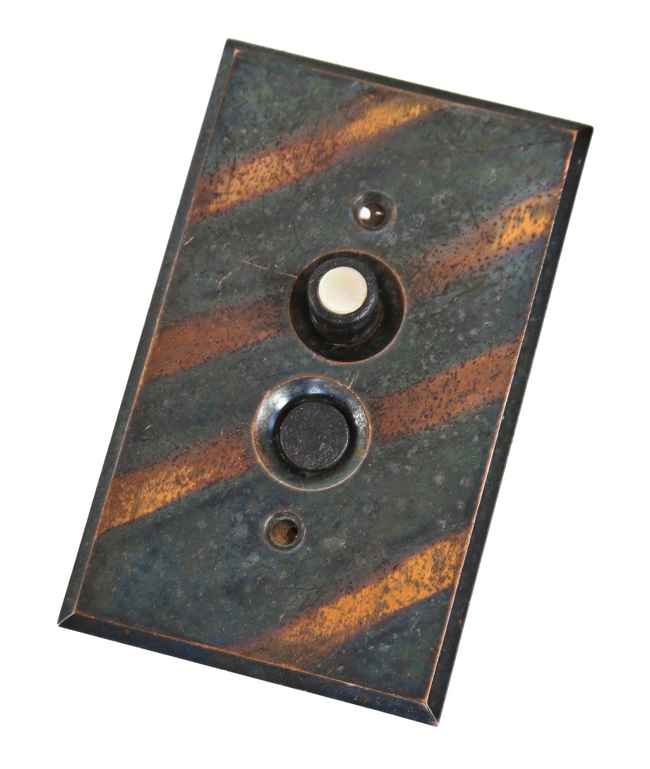 completely intact and operational american antique wall-mount early electric electric push button switch with copper-oxidized backplate