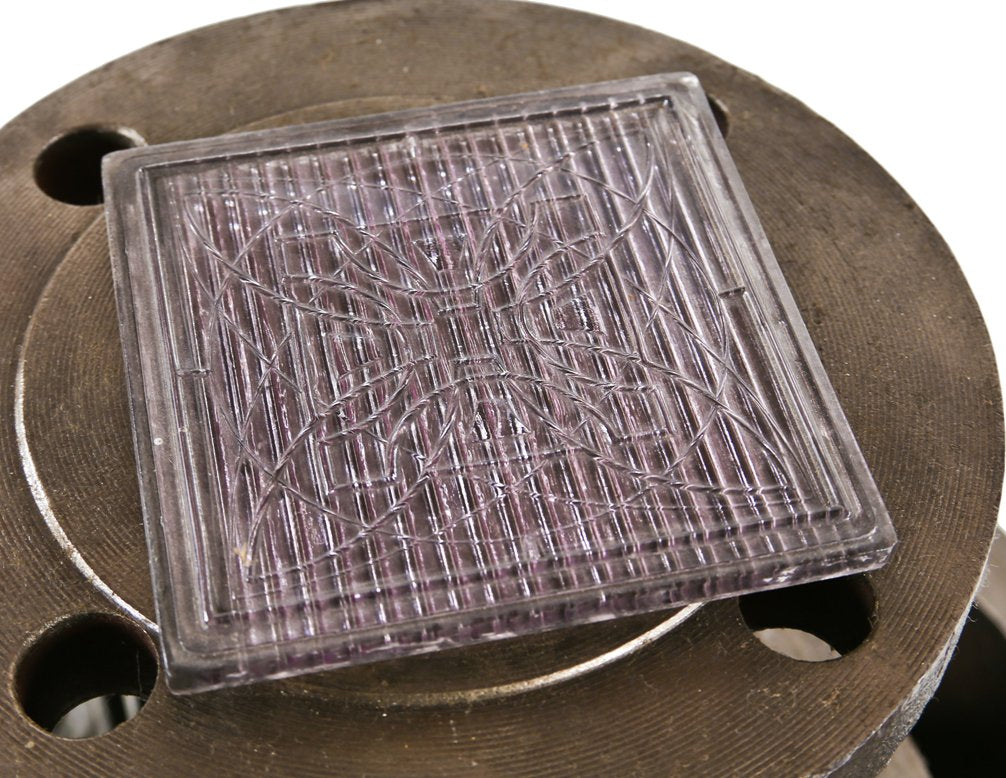 single early 20th century american exterior frank lloyd wright-designed luxfer glass prism tile with geometric flower motif