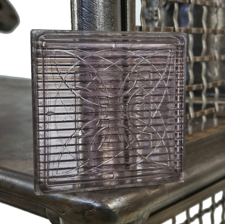 elegantly designed original c. 1900's exterior building facade "geometric flower" pattern luxfer prism glass tile with purple hue