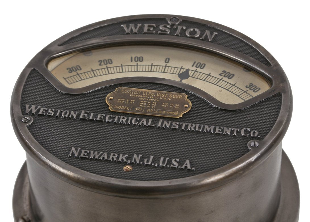 hard to find early 20th century american antique industrial cast iron weston voltmeter with original swing-out cast iron bracket