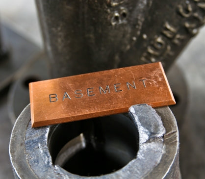 early 20th century single-sided solid copper "basement" open switchboard beveled edge switch identification plaque with lightly incised lettering