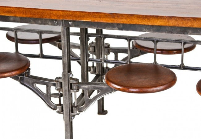 single early 1920's antique american industrial reinforced cast iron swing-out factory lunch table stool bracket with a uniform brushed metal finish