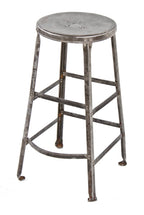 heavy duty c. 1930's american made antique industrial reinforced angled steel four-legged factory stool with riveted joints