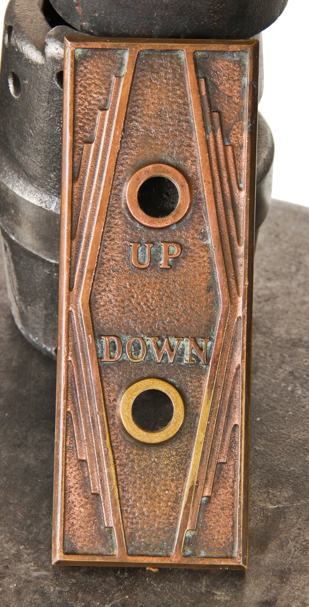 highly stylized "roaring twenties" art deco style ornamental cast bronze flush mount richman brothers building elevator push button backplate