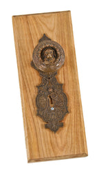 early 1870's original and highly collectible "doggie" figural doorknob with matching oversized escutcheon mounted on a custom-built wood plaque