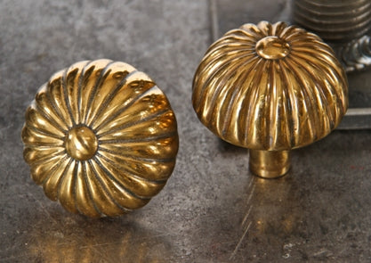matching set of late 19th century original interior residential ornamental cast bronze fluted doorknobs with centrally located buttons