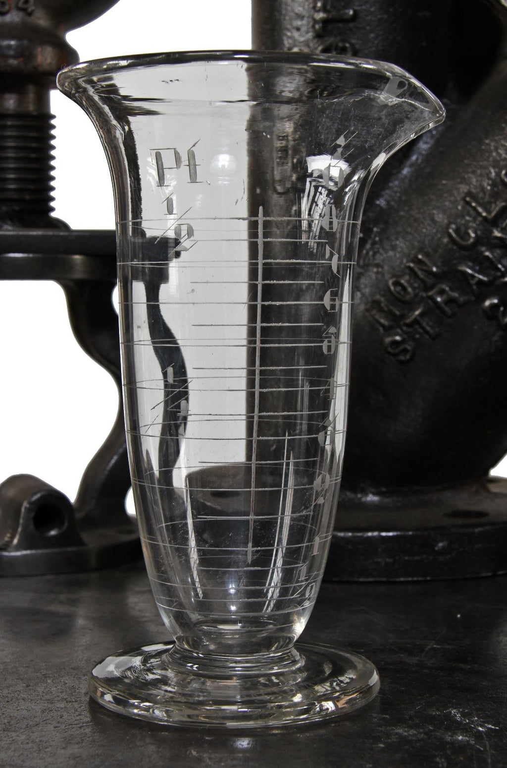 very clean and well maintained all original early 20th century american laboratory pressed glass conical-shaped measure with etched markings