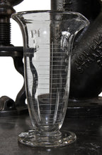 very clean and well maintained all original early 20th century american laboratory pressed glass conical-shaped measure with etched markings