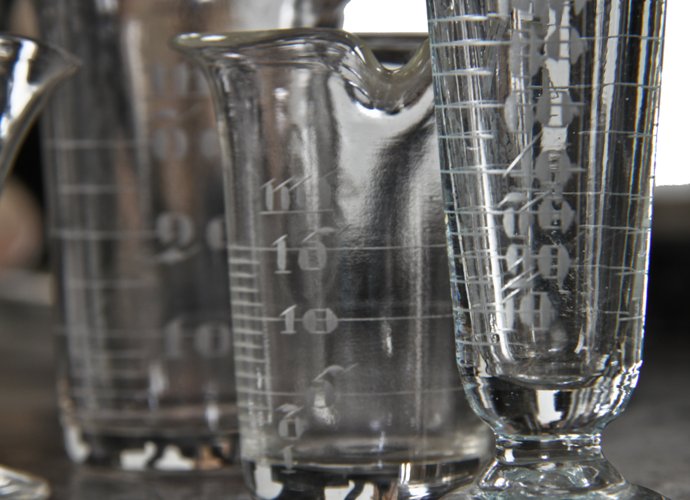 group of original early 20th century american antique medical or apothecary drugstore diminutive pressed laboratory glassware