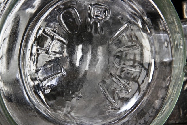 all original and seldom found oversized early 20th century antique american industrial well-maintained and cleaned clear glass "thorium" laboratory bottle with original ground glass stopper