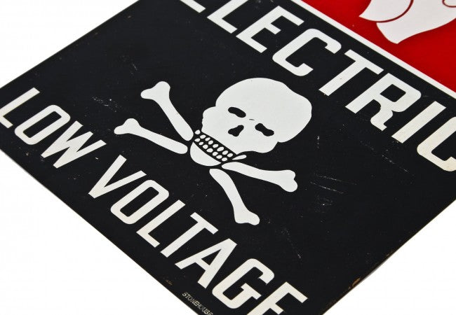hard to find c. 1940's original and vibrantly colored single-sided stamped steel "low voltage" cautionary or danger sign with skull & crossbones
