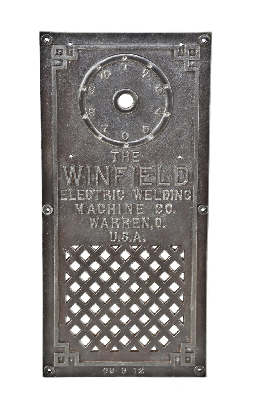 original early 20th century antique american industrial ornamental cast iron winfield spot-welding machine control panel with surrounding greek fret raised border