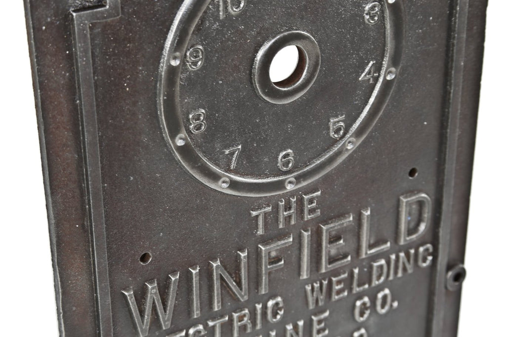 original early 20th century antique american industrial ornamental cast iron winfield spot-welding machine control panel with surrounding greek fret raised border