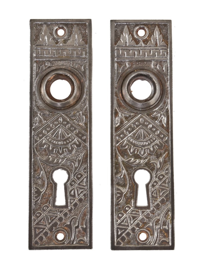 matching set of original late 19th century ornamental cast iron "oriental" pattern interior residential passage door backplates or escutcheons