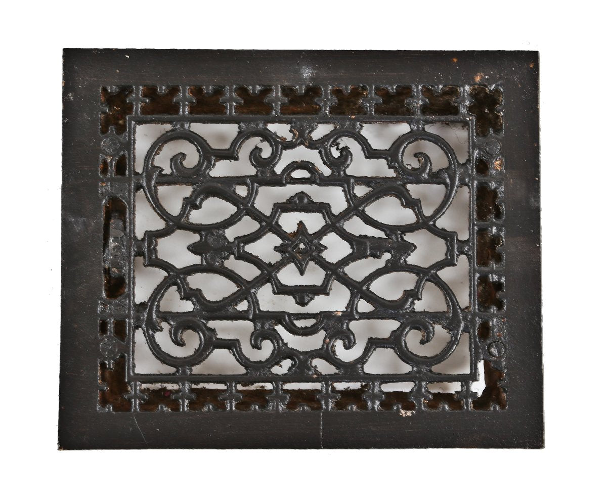 single late 19th century original and largely intact antique american ornamental black enameled cast iron floor or wall register