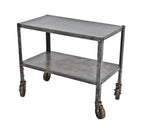 refinished late 1920's original american medical two-tier pressed and folded heavy gauge angled iron hospital kitchen supply table with casters