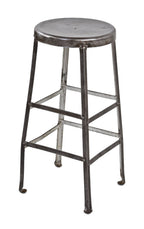 original c. 1920's american antique industrial heavy gauge riveted joint steel four-legged freestanding machine shop stool with inward-turned ball feet