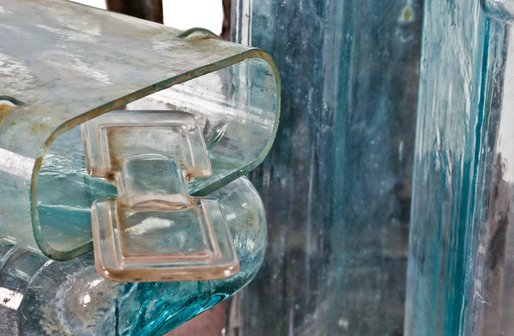 four early 20th century original and intact american antique industrial aqua blue glass exide rural residential thinly-shaped power plant battery jars with acid-spill glass covers