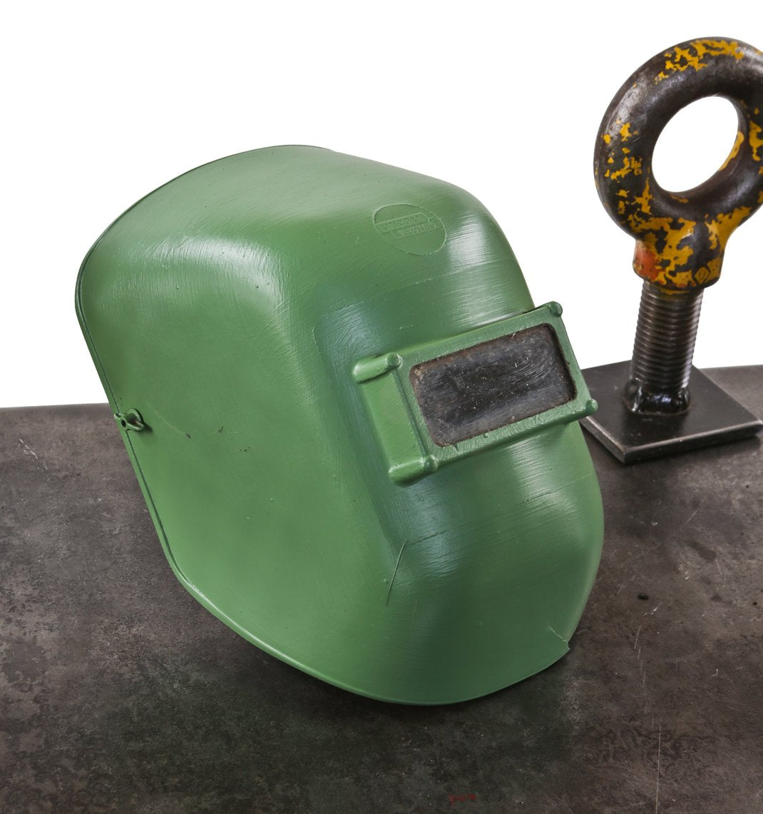 original factory green painted c. 1950's american industrial factory machine shop lincoln welding helmet with intact rectangular-shaped protective eye-shield