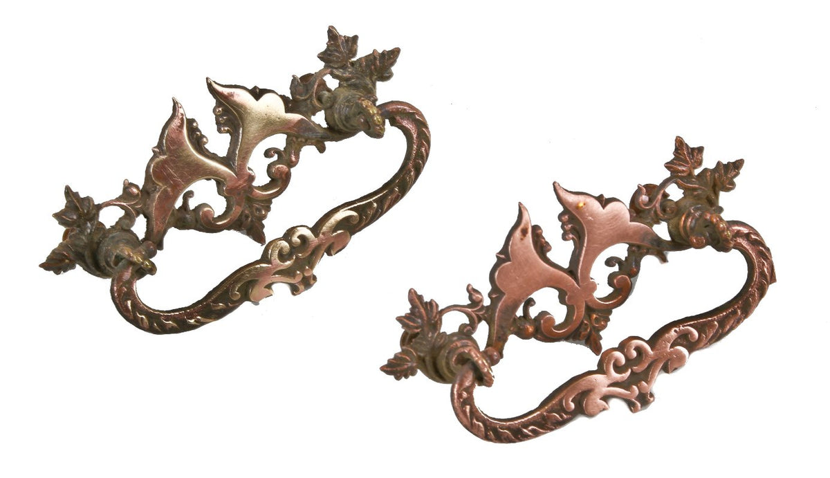 strikingly detailed original late 19th or early 20th century american victorian era ornamental cast brass interior residential built-in drawer pulls with drop handles