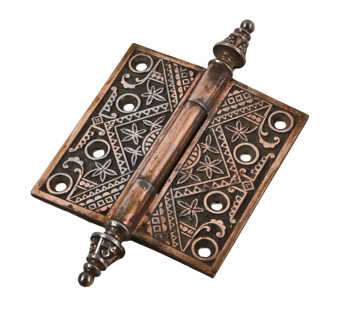 single late 19th century original and fully functional antique american eastlake style copper-plated ornamental cast iron residential passage door hinge with finials