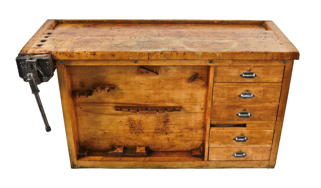 c. 1918 original and largely intact refinished hardwood double-sided school workshop bench containing a tool tray, multiple sliding drawers and sliding paneled cabinet doors