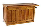 c. 1918 original and largely intact refinished hardwood double-sided school workshop bench containing a tool tray, multiple sliding drawers and sliding paneled cabinet doors
