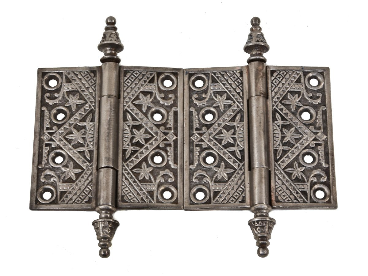 two refinished original and fully functional 19th century ornamental cast iron interior residential passage door loose pin hinges with distinctive tapered "steeple" finials