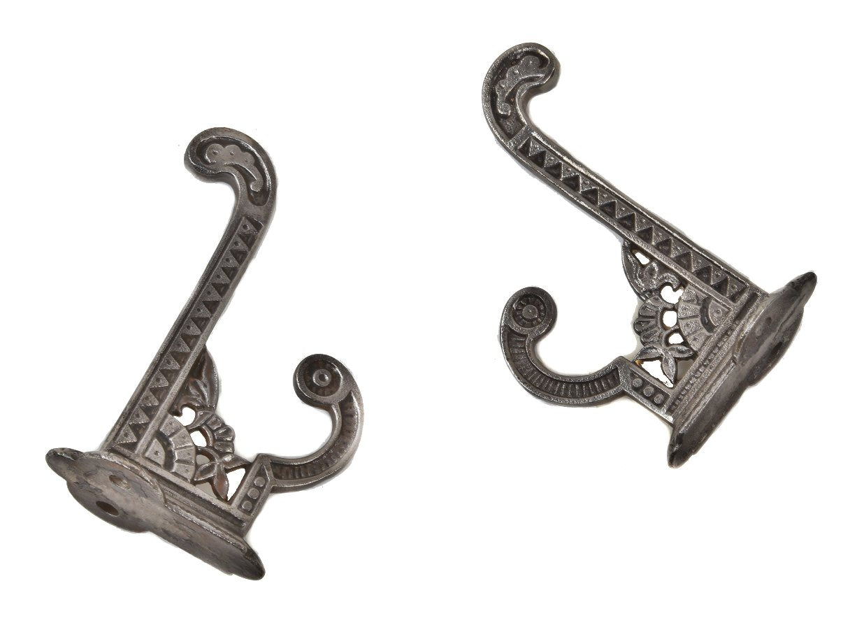 set of original 19th century antique american eastlake style ornamental cast iron "oriental" pattern interior residential wall-mount coat or garment hooks with brushed metal finish