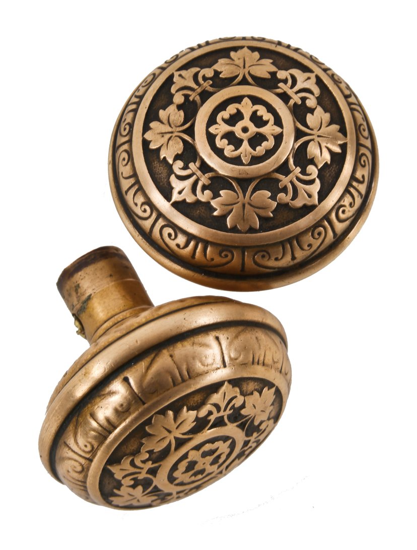pair of original oversized 19th century antique american ornamental cast brass residential vestibule door banded rim doorknobs with radially-designed allover leafage